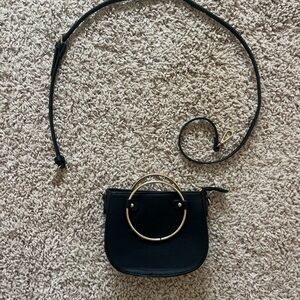Chic Black Handbag with Gold Accents